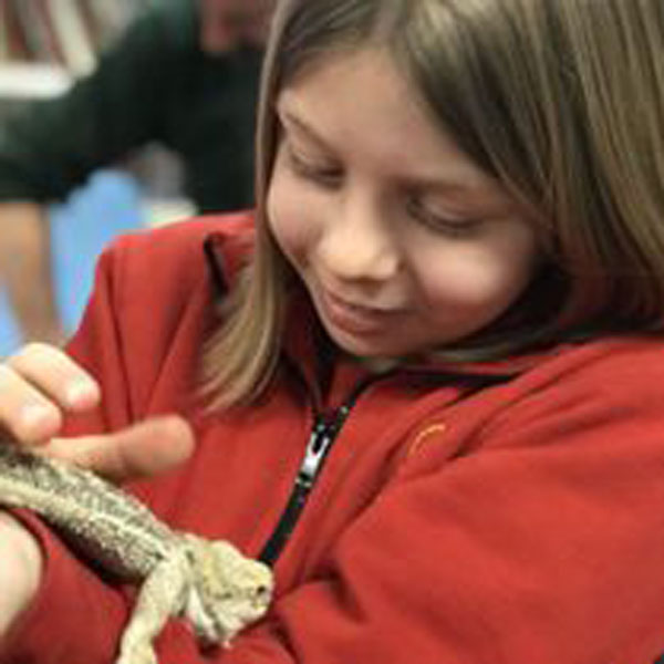 child with bearded dragon