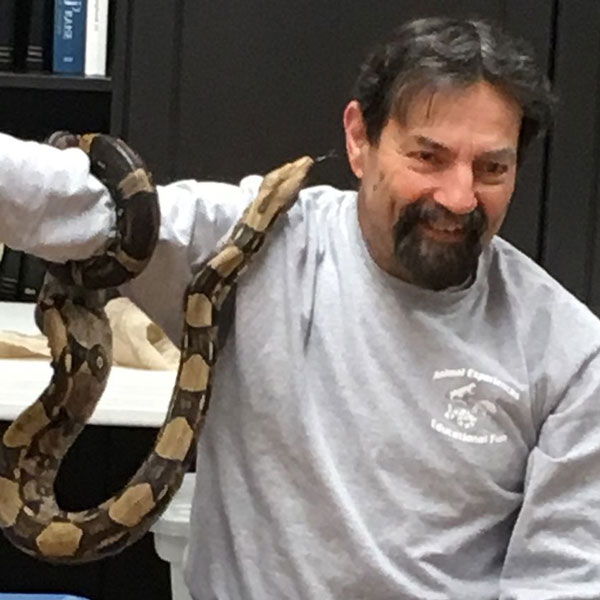man holding a snake